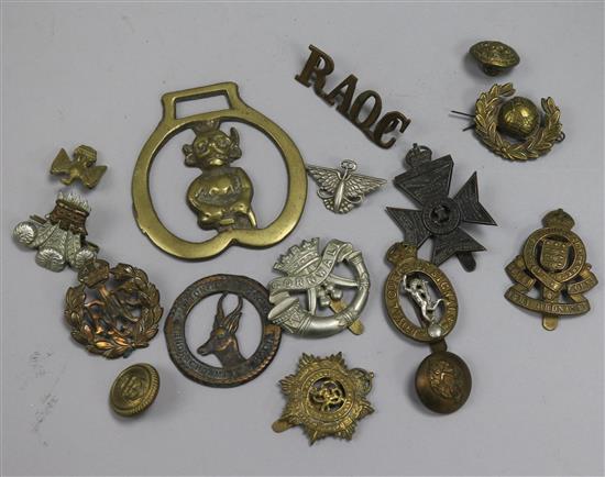A quantity of cap badges etc